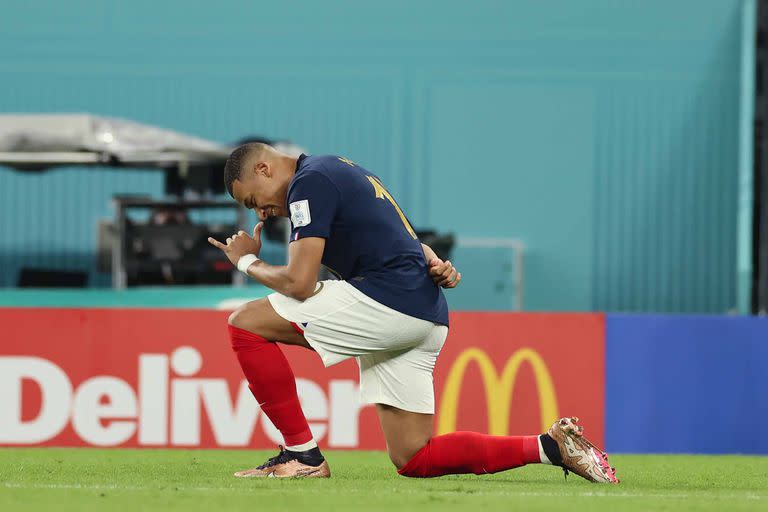 DOHA, QATAR - NOVEMBER 26: Kylian Mbappe of France celebrates after scoring to give the side a 1-0 lead during the FIFA World Cup Qatar 2022 Group D match between France and Denmark at Stadium 974 on November 26, 2022 in Doha, Qatar. (Photo by Youssef Loulidi/Fantasista/Getty Images)
