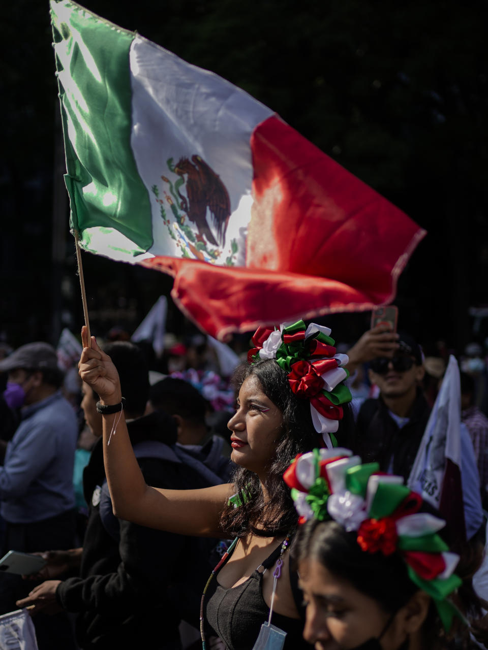 Supporters of Mexican President Andres Manuel Lopez Obrador march at the Angel of Independence monument in Mexico City, Sunday, Nov. 27, 2022. (AP Photo/Eduardo Verdugo)