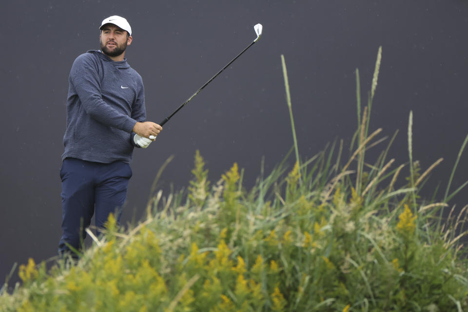 Scottie Scheffler of the United States watches his tee shot on the first hole during a practice round ahead of the British Open Golf Championships at Royal Troon golf club in Troon, Scotland, Tuesday, July 16, 2024. (AP Photo/Scott Heppell)