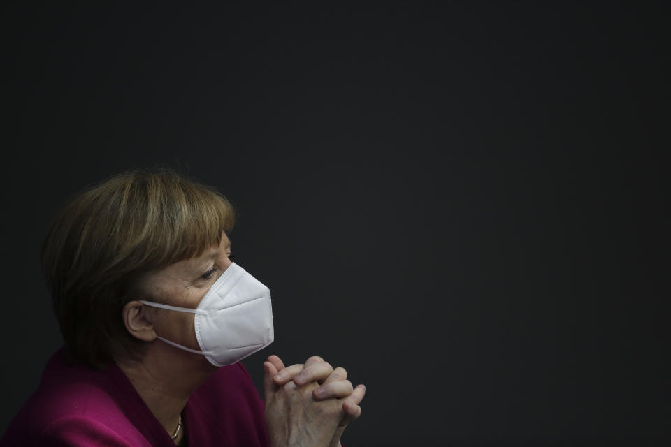 File - In this Thursday, March 25, 2021 file photo, German Chancellor Angela Merkel attends a session of the German parliament Bundestag ahead of an European Union summit at the Reichstag building in Berlin, Germany. German Chancellor Angela Merkel has talked about her country’s difficulties, during the coronavirus pandemic. In a lengthy television interview late Sunday she called for greater flexibility to tackle the latest surge in cases. (AP Photo/Markus Schreiber, file)