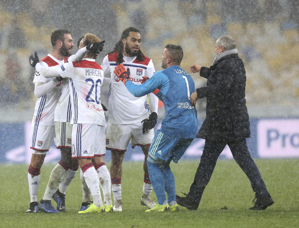 Lyon players react at the end of the Group F Champions League soccer match between Shakhtar Donetsk and Lyon at the Olympiyskiy stadium, in Kiev, Ukraine, Wednesday, Dec.12, 2018. (AP Photo/Efrem Lukatsky)