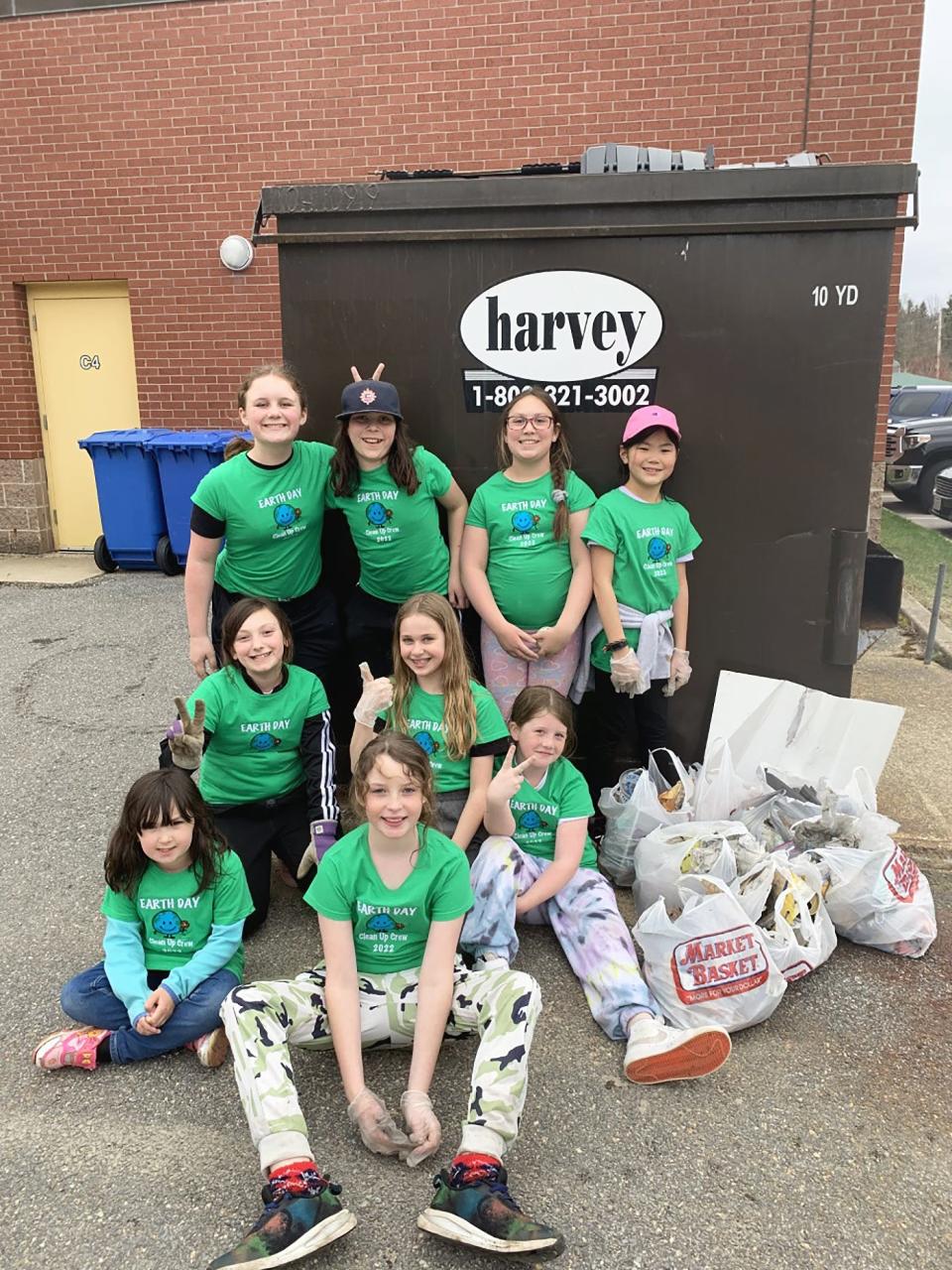 Audrianna Malloy, far left in middle row, is shown with Westminster Elementary School classmates during the Earth Day cleanup that Malloy organized on May 2.