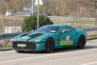 <p>A successor to the Aston Martin DBS is due to be launched by the end of this year. Photos of the first prototypes show sizeable differences to the current DBS. The side profile appears longer, has a noticeably wider grille and a chunkier rear end. The DBS successor is rumoured to revive the Vanquish nameplate and will serve as the flagship of Aston Martin's front-engine line-up.</p>