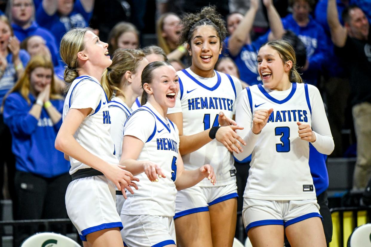 Ishpeming celebrates their win over Fowler in the Division 4 girls basketball state semifinal on Thursday, March 21, 2024, at the Breslin Center in East Lansing.