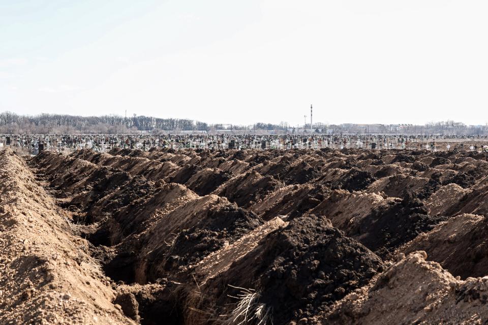 Lines of pre-dug graves at a cemetery on the outskirts of Odesa, Ukraine, on Thursday, March 17, 2022. (Jonathan Alpeyrie/Bloomberg via Getty Images)