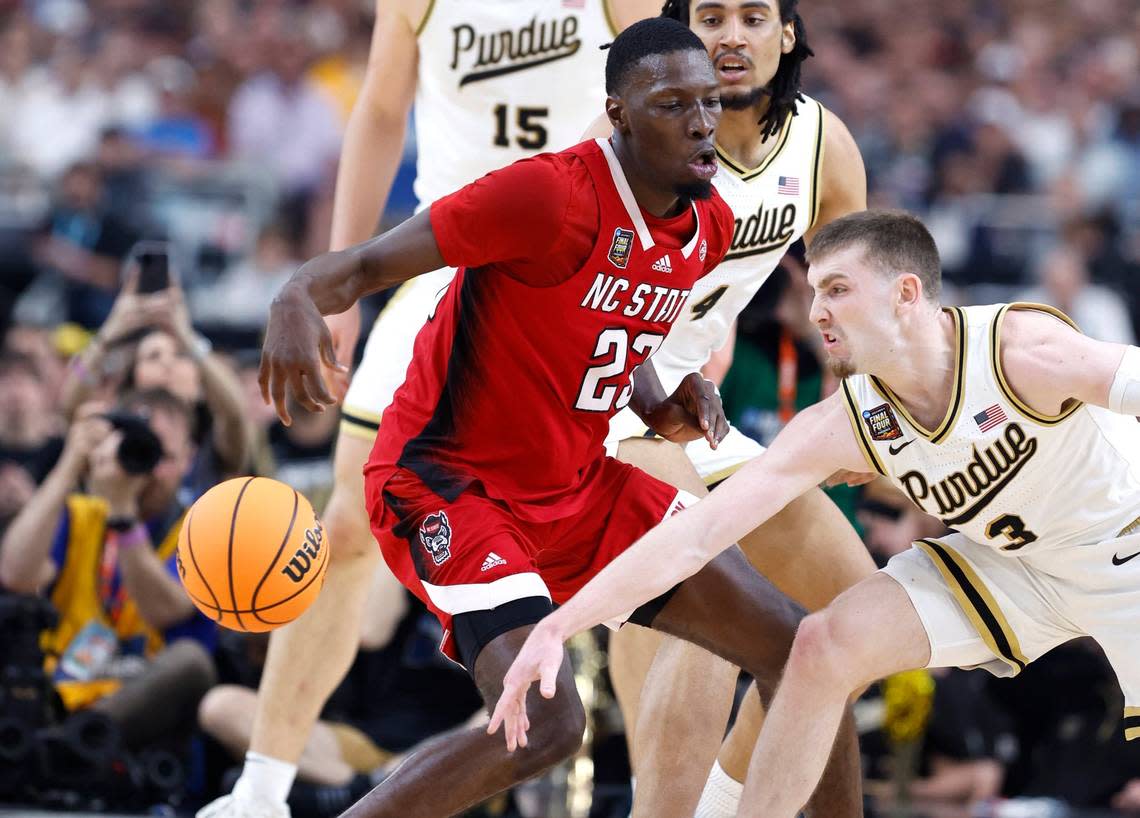 Purdue’s Braden Smith (3) knocks the ball from N.C. State’s Mohamed Diarra (23) during the first half of N.C. State’s game against Purdue in the NCAA Tournament national semfinals at State Farm Stadium in Glendale, Ariz., Saturday, April 6, 2024. Ethan Hyman/ehyman@newsobserver.com