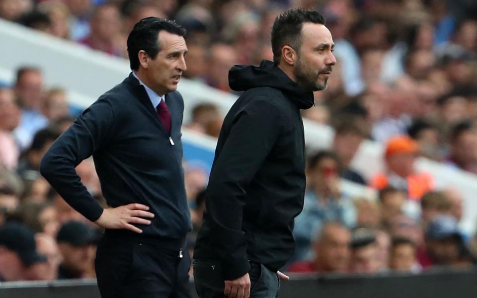 Aston Villa's Spanish head coach Unai Emery and Brighton's Italian head coach Roberto De Zerbi - AFP/GEOFF CADDICK