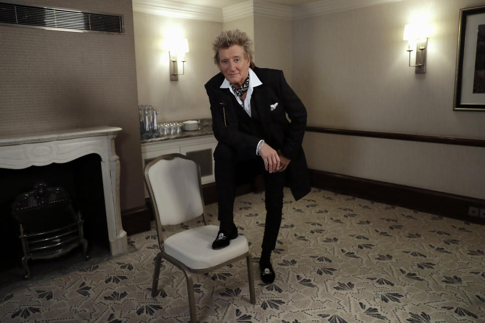 In this photo taken on Thursday, Nov. 14, 2019, British singer Rod Stewart poses for the media after an interview with The Associated Press at a hotel in London. Stewart, known for decades as a consummate crooner, rocker, fashion plate and tongue-in-cheek sex symbol, is adding a new element to his image: serious model railroad builder. The one time front man of The Faces who has hits dating back to the 1960s has put the finishing touch on a 23-year project that has landed him on the cover of Railway Modeller magazine, a far cry from Rolling Stone, whose cover he has graced many times. (AP Photo/Matt Dunham)