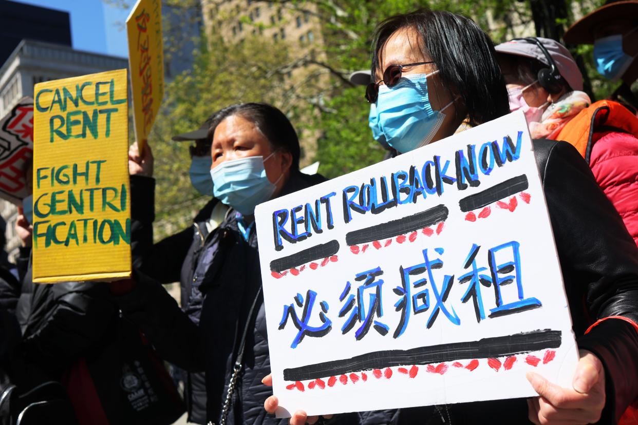 People gather for a rally protesting rent hikes at City Hall Park on April 28, 2022.