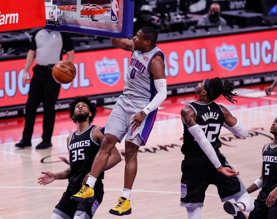 Detroit Pistons guard Dennis Smith Jr. (0) dunks against Sacramento during the first half at Little Caesars Arena in Detroit on Friday, Feb. 26, 2021.