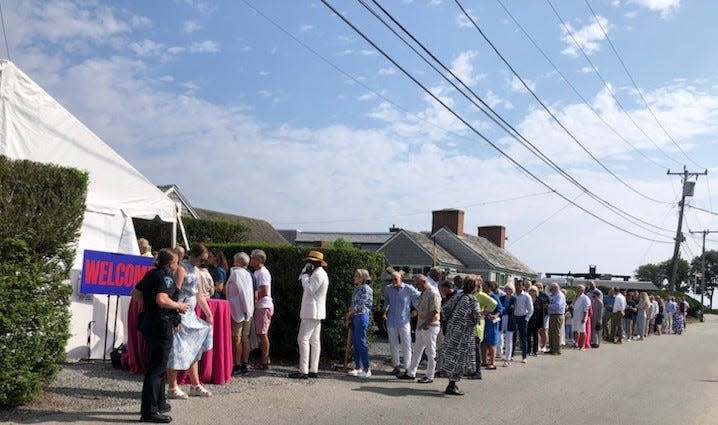 First lady Jill Biden was expected to greet about 300 guests Friday during "A Summer Reception with Jill Biden," at the home of Bryan Rafanelli and his husband Mark Walsh in Provincetown. Attendees lined up to enter the reception on Commercial Street.