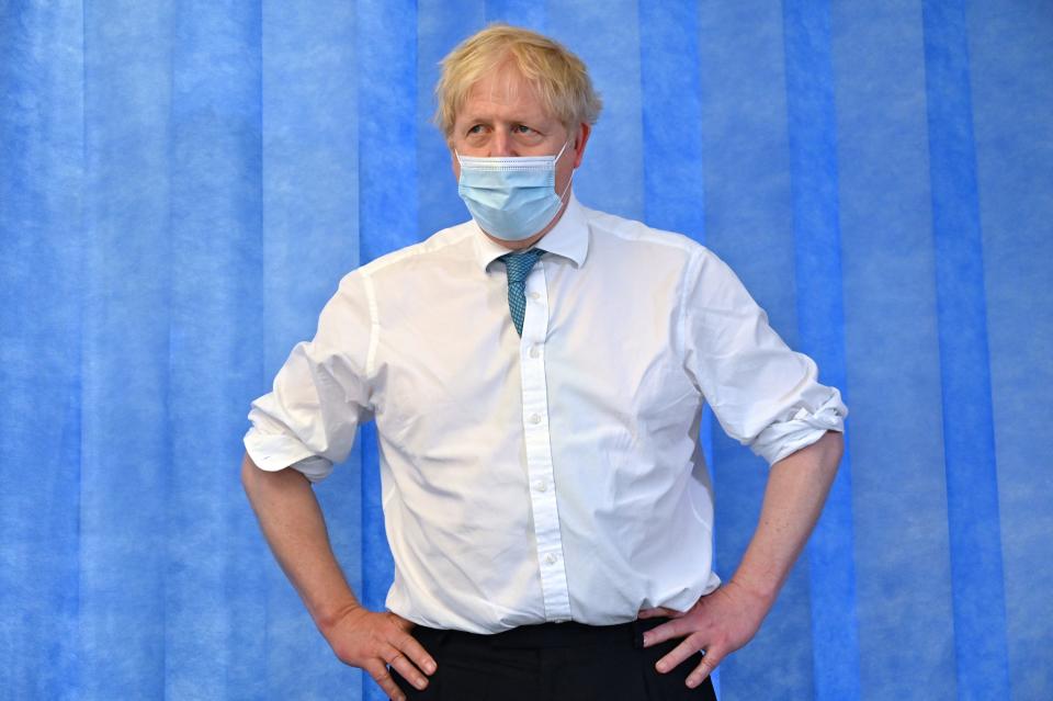 Britain's Prime Minister Boris Johnson visits Colchester hospital in Colchester, eastern England on May 27, 2021. - Britain's government 