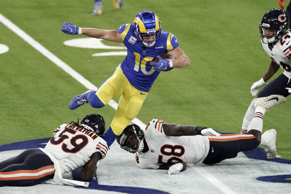 Los Angeles Rams wide receiver Cooper Kupp, top, leaps over Chicago Bears inside linebacker Danny Trevathan (59) and inside linebacker Roquan Smith (58) during the second half of an NFL football game Monday, Oct. 26, 2020, in Inglewood, Calif. (AP Photo/Ashley Landis )