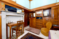 <p>The two-level studio boasts unique decor with elements such as a workspace in an old fireplace and beautiful wood furniture. <br>(Airbnb) </p>
