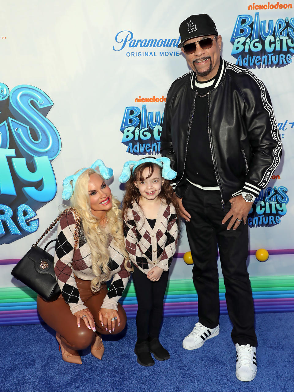 Ice-T stands beside his wife and daughter. (Rob Kim / Getty Images)