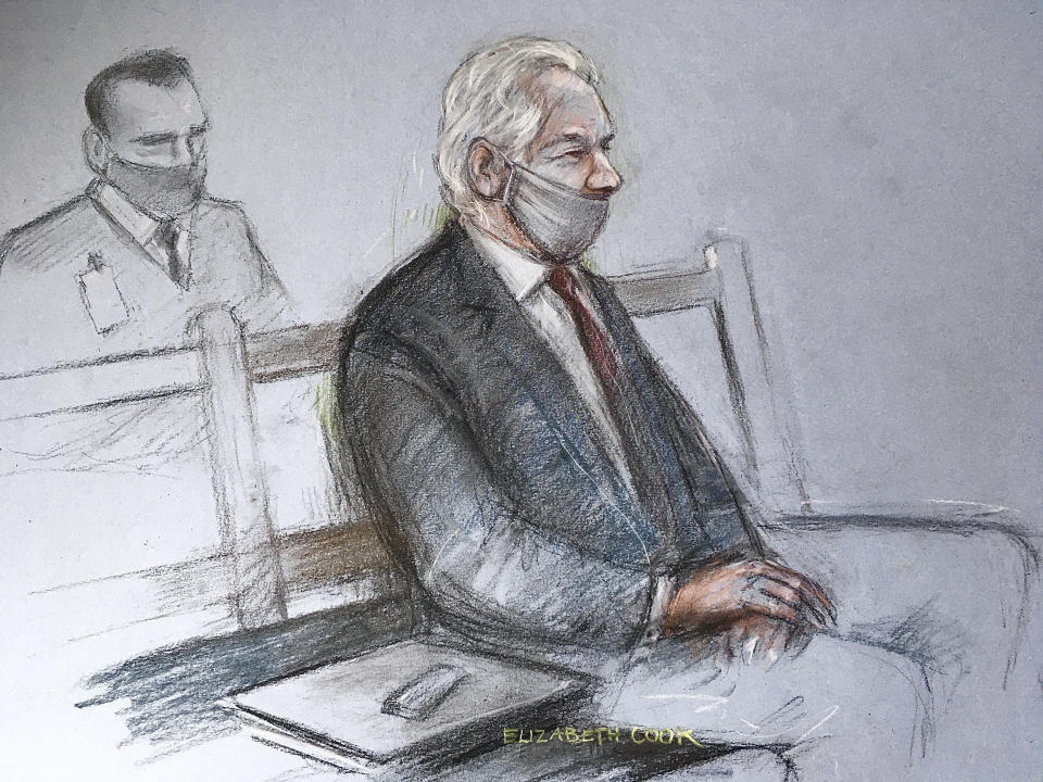 This is a court artist sketch by Elizabeth Cook of Julian Assange appearing at the Old Bailey in London for the ruling in his extradition case, in London, Monday, Jan. 4, 2021. A British judge has rejected the United States’ request to extradite WikiLeaks founder Julian Assange to face espionage charges, saying it would be “oppressive” because of his mental health. District Judge Vanessa Baraitser said Assange was likely to kill himself if sent to the U.S. The U.S. government said it would appeal the decision. (Elizabeth Cook/PA via AP)