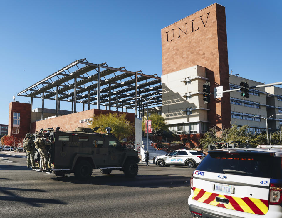 SWAT officers work the scene of a shooting on the University of Nevada, Las Vegas, campus on Wednesday, Dec. 6, 2023, in Las Vegas. (Madeline Carter/Las Vegas Review-Journal via AP)