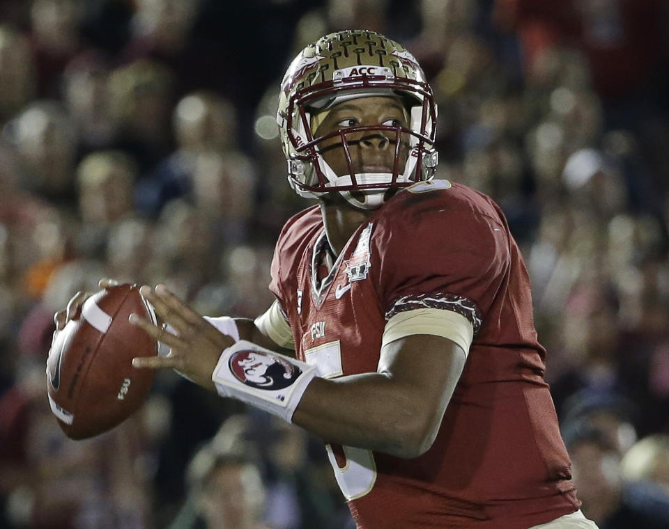 Florida State's Jameis Winston (5) throws during the first half of the NCAA BCS National Championship college football game against Auburn Monday, Jan. 6, 2014, in Pasadena, Calif.(AP Photo/David J. Phillip)