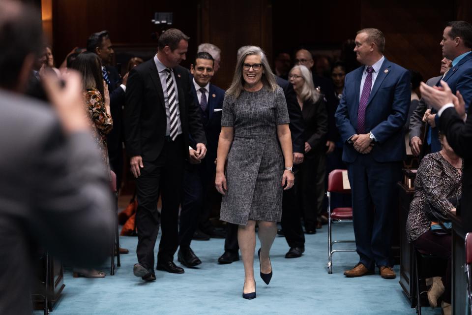 Gov. Katie Hobbs enters the Arizona House of Representatives to give her State of the State address during the opening session of the 56th Legislature on Jan. 9, 2023, in Phoenix.