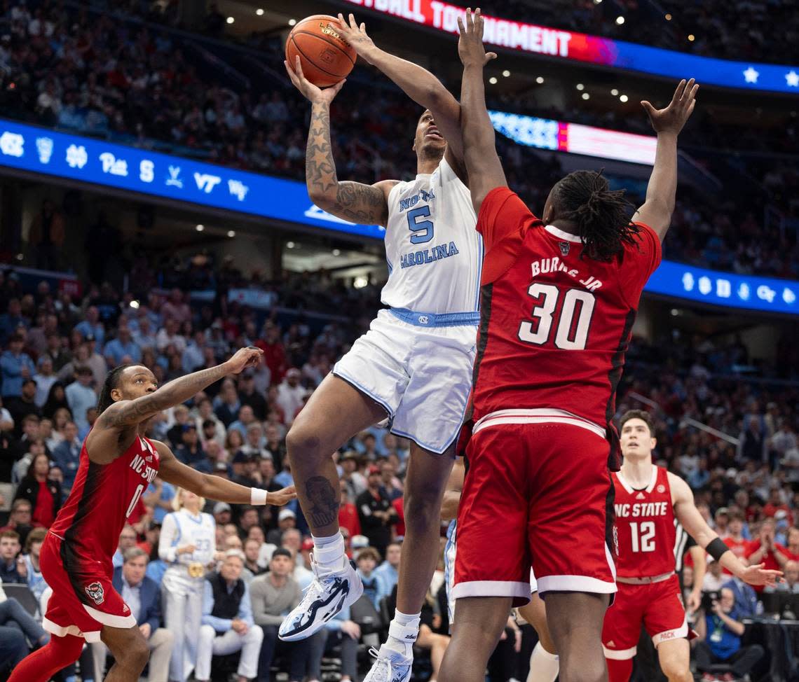 North Carolina’s D.J. Burns Jr. (30) defends North Carolina’s Armando Bacot (5) in the second half during the ACC Men’s Basketball Tournament Championship at Capitol One Arena on Saturday, March 16, 2024 in Washington, D.C.