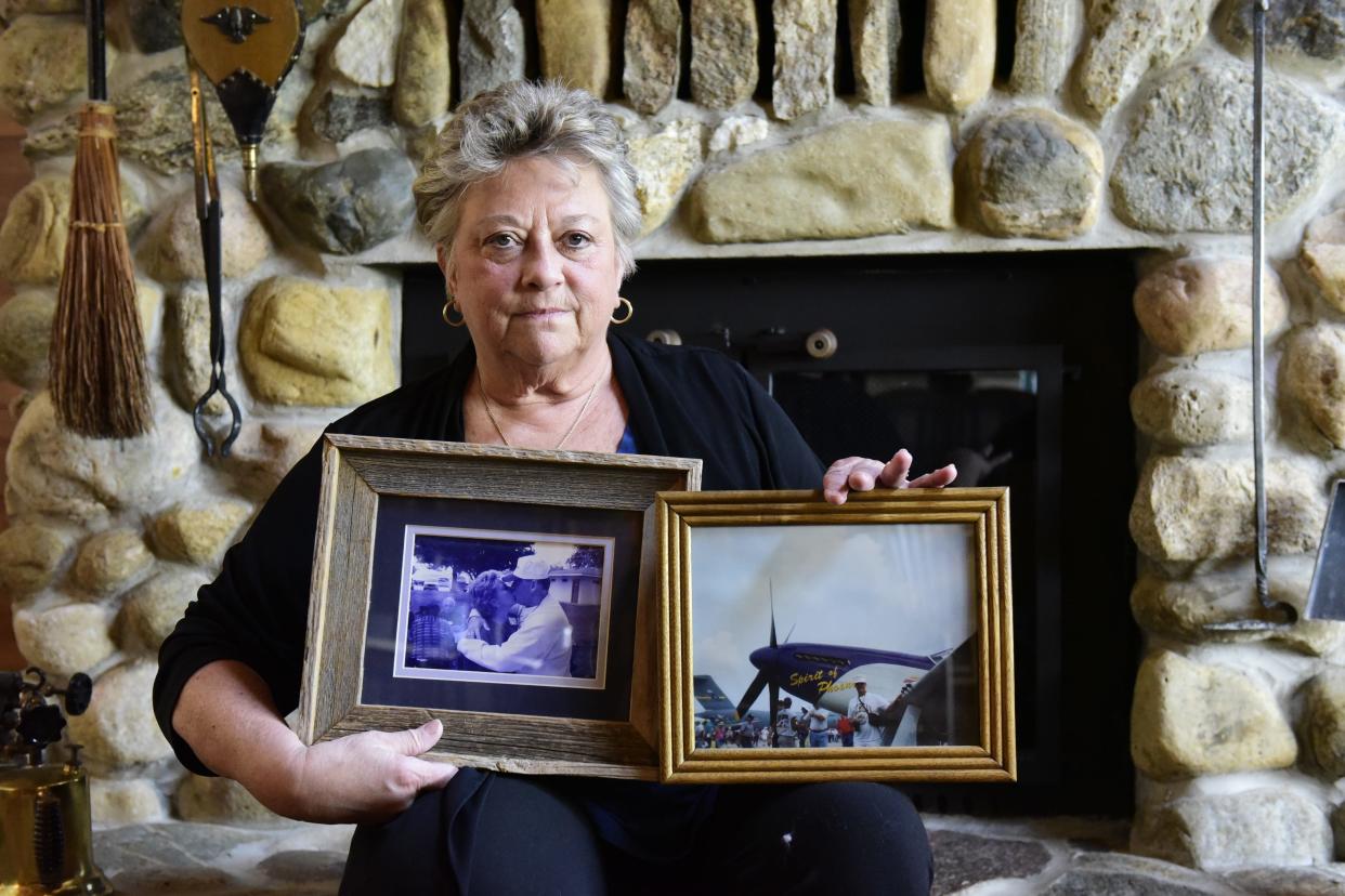 Diane Reynolds of Ashland holds two of her favorite photos of her late husband, Gene, who served in the Army from 1963 to 1969. Gene was in Korea during the Vietnam War.