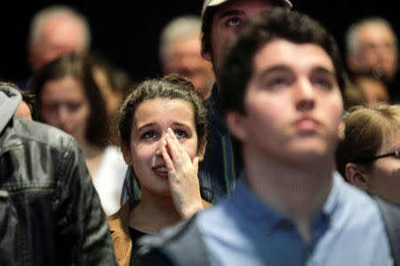 French university student and Jean-Luc Melenchon supporter Clara Lamotte reacts as she watches the televised French presidential elections at a viewing event held by the Universite de Montreal in Montreal, Quebec, Canada. REUTERS/Dario Ayala