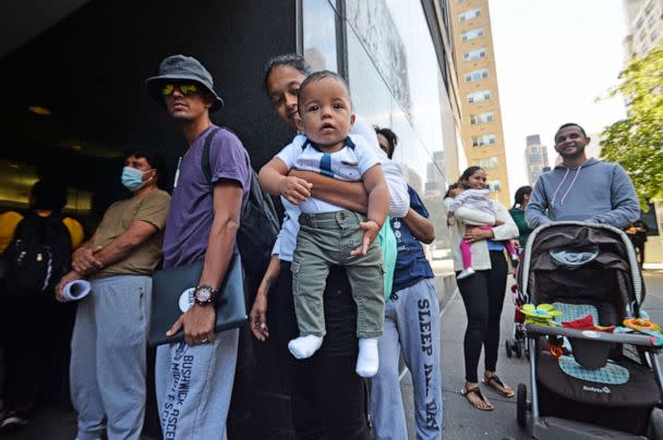 PHOTO: One year old Venezuelan migrant Dixon waits with his mother Maria outside of the New York Catholic Center, hoping to get some assistance, on Aug. 16, 2022, in New York. (Matthew McDermott/Polaris)