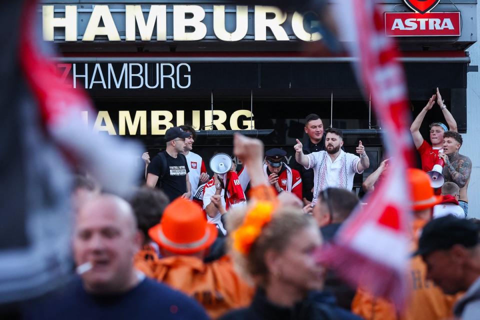 Thousands of Dutch and Polish fans have descended on Hamburg ahead of their 2pm game (AFP via Getty Images)