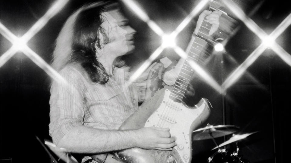 Rory Gallagher photographed in a studio for his 'Top Priority' album cover on 11th June 1979. He plays a Fender Stratocaster guitar.