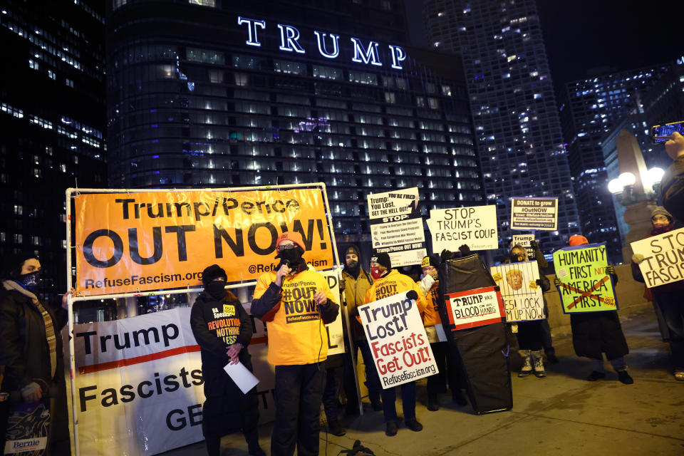 CHICAGO, ILLINOIS - JANUARY 07: A small group of demonstrators protests near Trump Tower on January 07, 2021 in Chicago, Illinois. They called for the removal of President Donald Trump from office after a pro-Trump mob stormed the Capitol building in Washington, DC yesterday as lawmakers met to count the Electoral College votes in the presidential election.  (Photo by Scott Olson/Getty Images)