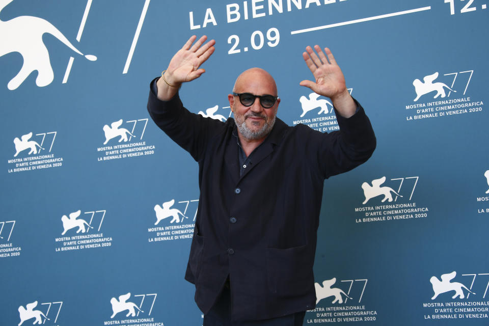 Director Gianfranco Rosi poses for photographers at the photo call for the film 'Notturno' during the 77th edition of the Venice Film Festival in Venice, Italy, Tuesday, Sept. 8, 2020. (Photo by Joel C Ryan/Invision/AP)