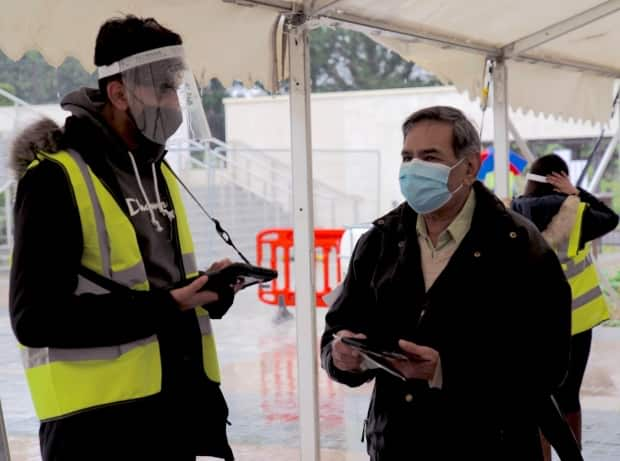 Volunteers welcome those with appointments to a vaccination centre at Shree Swaminarayan Mandir Kingsbury in North London, where they are aiming to give 1,300 vaccinations a day. Faith leaders in Saskatchewan would like to see similar centres set up here. 