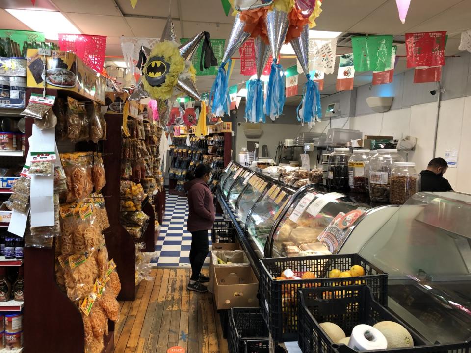 People shop at M.M. San Juan's Mexican Grocery Store in Arcadia, Wis.