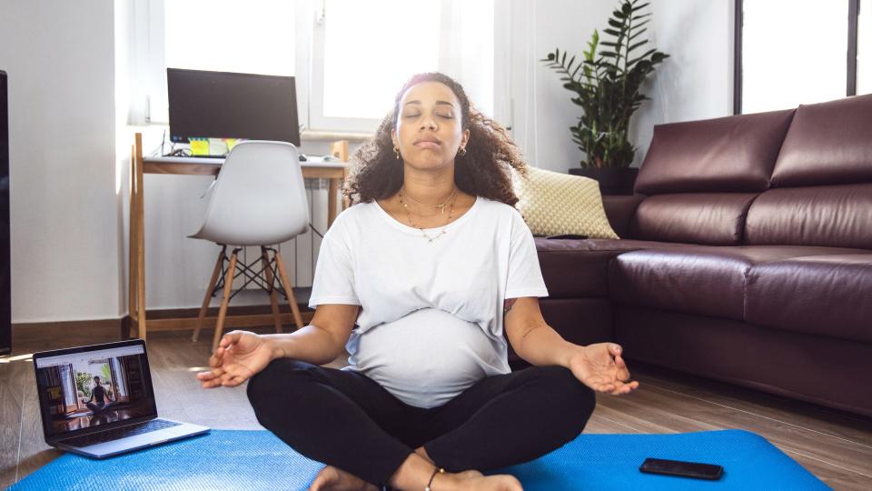 Pregnant woman practicing Yoga