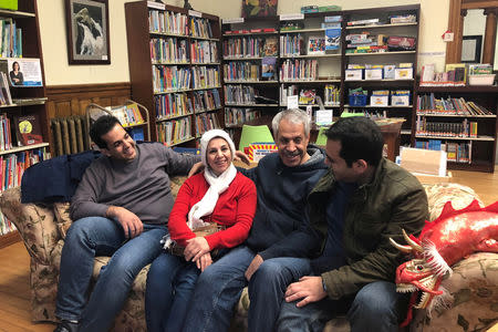 An Iranian family reunites at the Haskell Free Library and Opera House, which straddles the U.S.-Canada border in Stanstead, Quebec and in Derby Line, Vermont, U.S., November 3, 2018. Picture taken November 3, 2018. REUTERS/Yeganeh Torbati