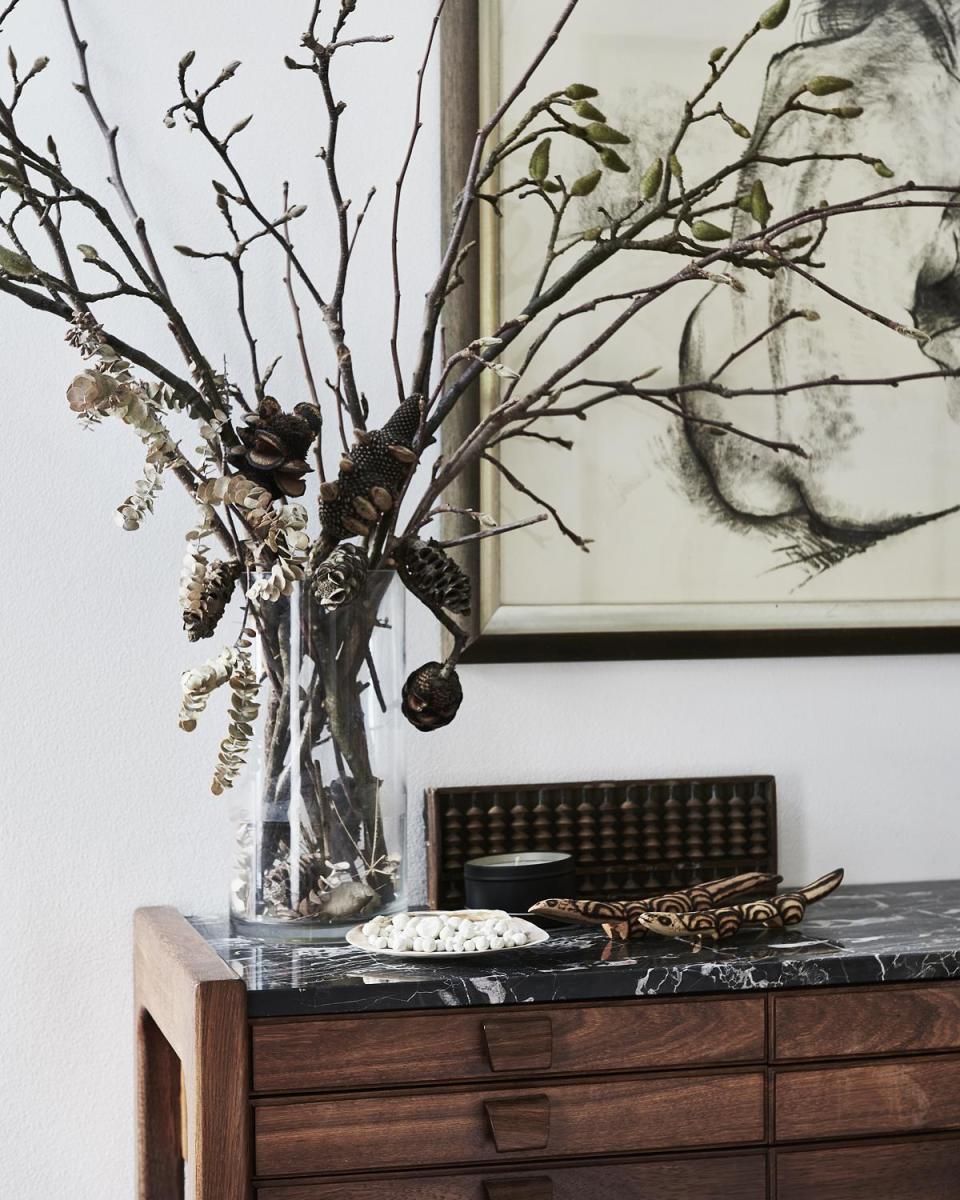 A simple arrangement of dried flowers and foliage