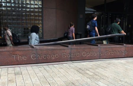 People walk by the Chicago Board Options Exchange (CBOE) Global Markets headquarters building in Chicago, Illinois, U.S., September 19, 2018.  REUTERS/Michael Hirtzer