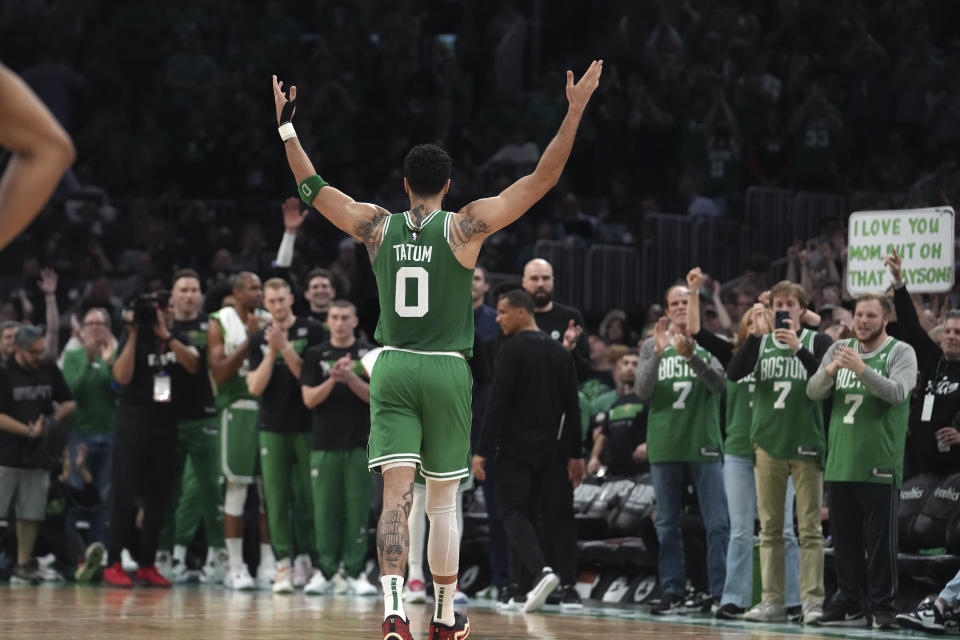 Boston Celtics forward Jayson Tatum receives applause as he steps off the court near the end of Game 7 against the Philadelphia 76ers in the Eastern Conference semifinal series, Sunday, May 14, 2023, in Boston. (AP Photo/Steven Senne)