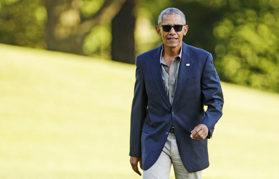<p>The ever-svelte Barack looks a bit swallowed up by this navy blazer, but the sunglasses are so dope, we'll let it slide. </p>