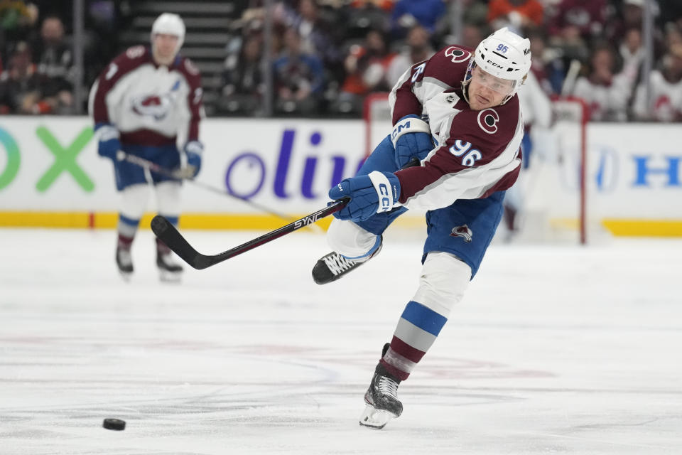 Colorado Avalanche right wing Mikko Rantanen (96) shoots during the second period of an NHL hockey game against the Anaheim Ducks in Anaheim, Calif., Sunday, April 9, 2023. (AP Photo/Ashley Landis)