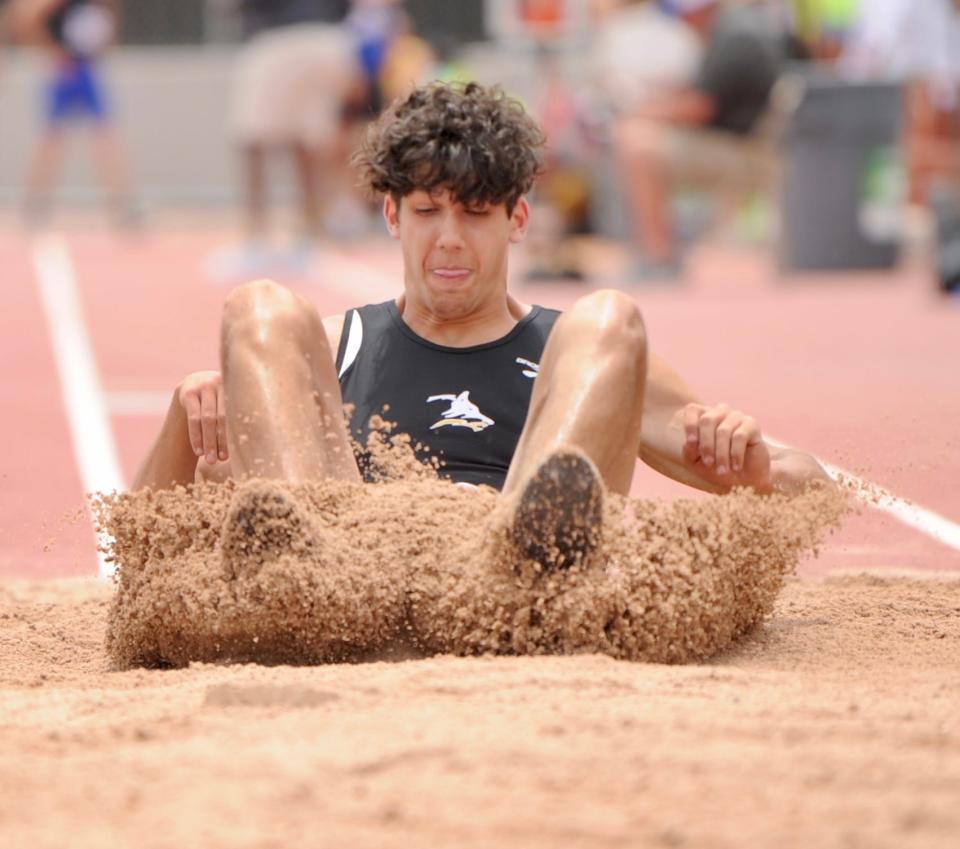 Cisco's Jaden White lands in the triple jump at the state track and field meet last year in Austin.