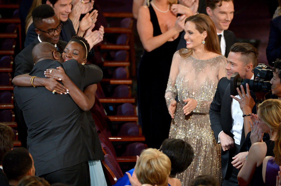 Steve McQueen, left, and Lupita Nyong'o celebrate in the audience after "12 Years a Slave" is announced as winner of the award for best picture of the year during the Oscars at the Dolby Theatre on Sunday, March 2, 2014, in Los Angeles. (Photo by John Shearer/Invision/AP)