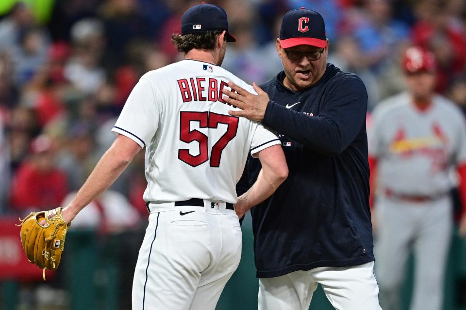 Cleveland Guardians manager Terry Francona, right, pats starting pitcher Shane Bieber on the back after removing him from the baseball game against the St. Louis Cardinals during the seventh inning Friday, May 26, 2023, in Cleveland. (AP Photo/David Dermer)