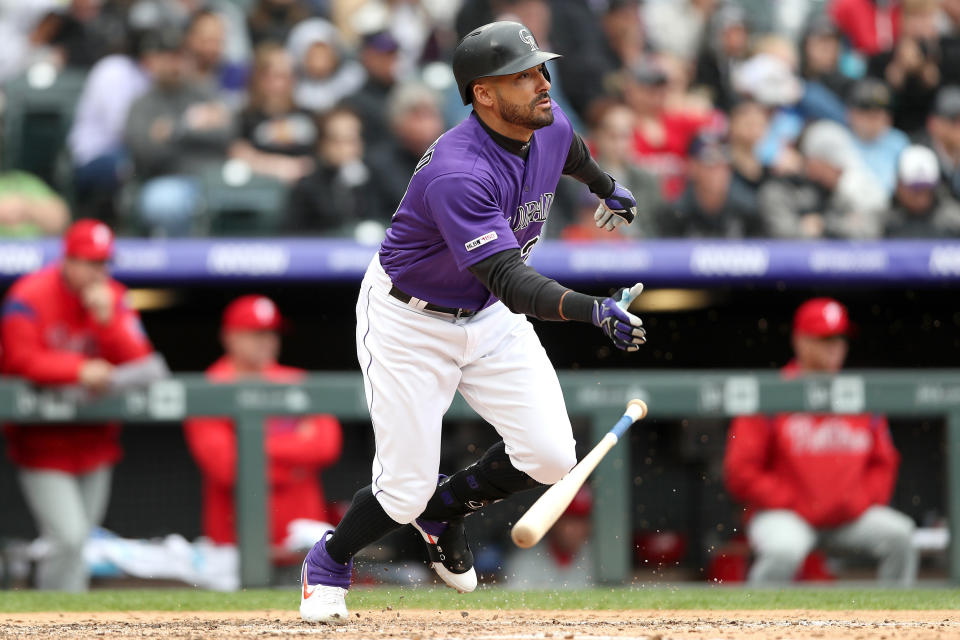 Ian Desmond  #20 of the Colorado Rockies hits a RBI single in the sixth inning against the Philadelphia Phillies at Coors Field on April 21, 2019 in Denver, Colorado. (Photo by Matthew Stockman/Getty Images)