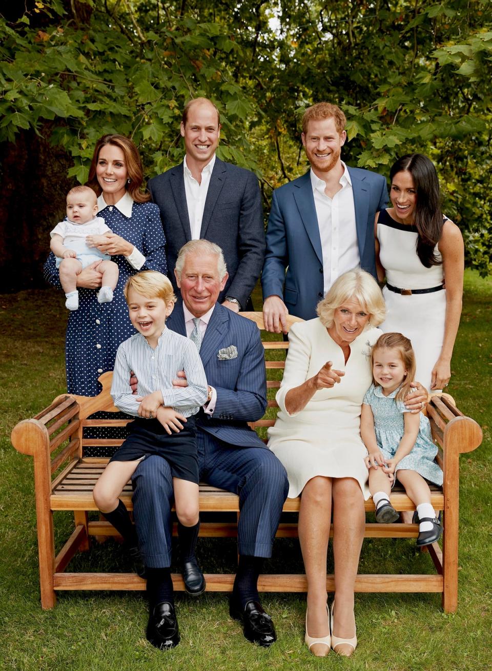 The Prince of Wales poses for an official portrait to mark his 70th Birthday in the gardens of Clarence House, with his wife Camilla Duchess of Cornwall, Prince Willliam Duke of Cambridge, Catherine Duchess of Cambridge, Prince George, Princess Charlotte, Prince Louis, Prince Harry Duke of Sussex and Meghan Duchess of Sussex (Chris Jackson/AP)