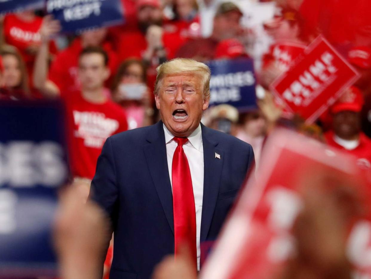 Donald Trump addresses a crowd in Charlotte, NC, at his last in-person rally before the coronavirus lockdown: Reuters