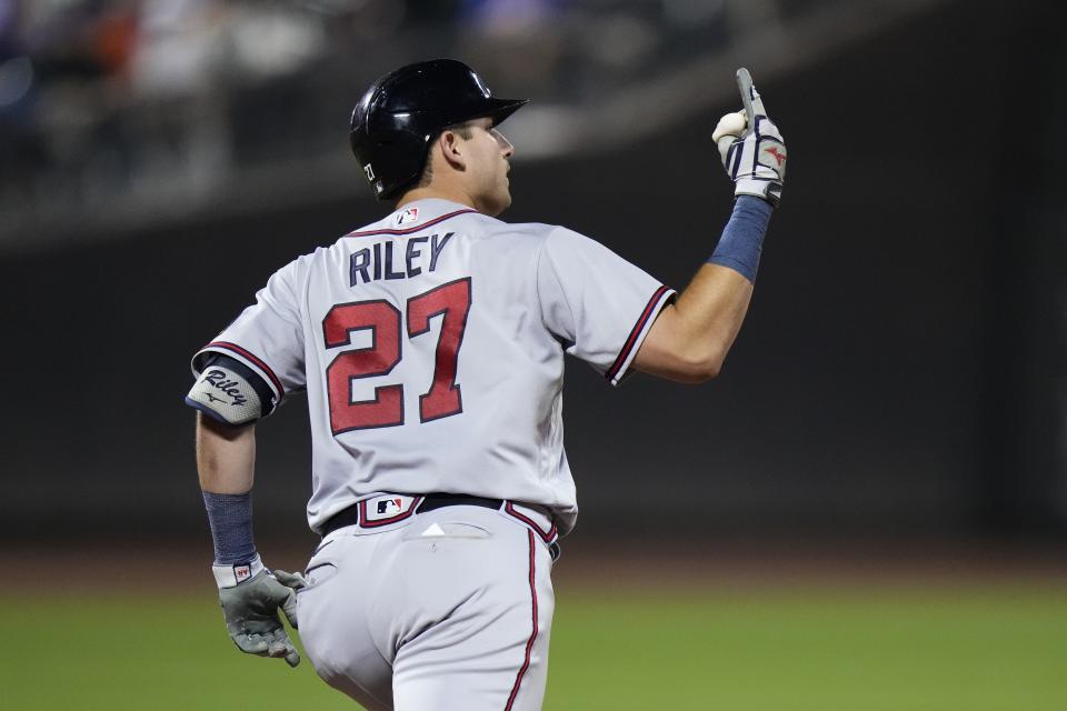 Atlanta Braves' Austin Riley gestures as he runs the bases after hitting a home run during the seventh inning of a baseball game against the New York Mets Friday, Aug. 11, 2023, in New York. (AP Photo/Frank Franklin II)