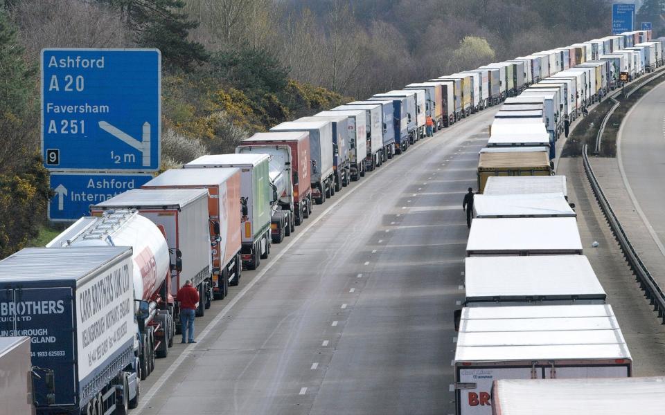 Lorries parked in a section of the closed M20 motorway, near Dover, in 2008 as part of Operation Stack. Many logistics experts fear a return of massive tailbacks in the event of increased border friction post-Brexit - AFP