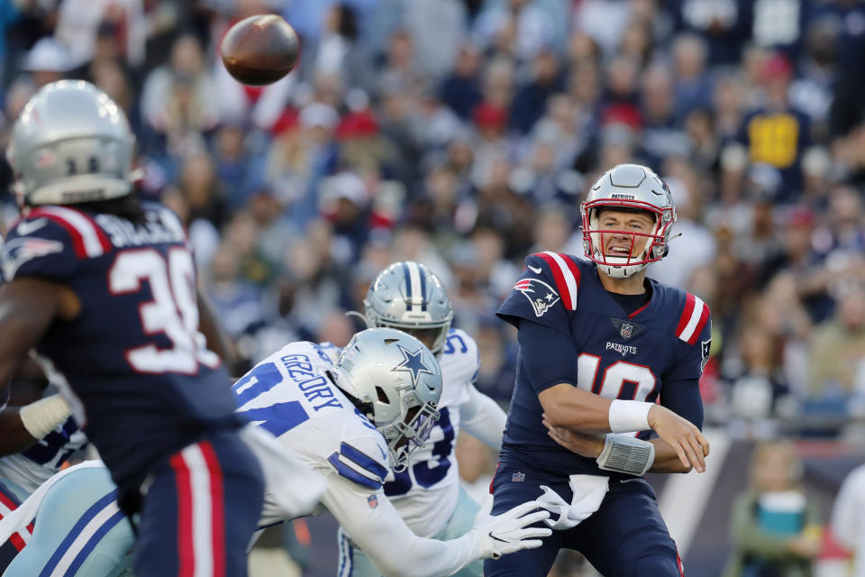 New England Patriots quarterback Mac Jones (10) throws a pass during the first half of an NFL football game against the Dallas Cowboys, Sunday, Oct. 17, 2021, in Foxborough, Mass. (AP Photo/Michael Dwyer)