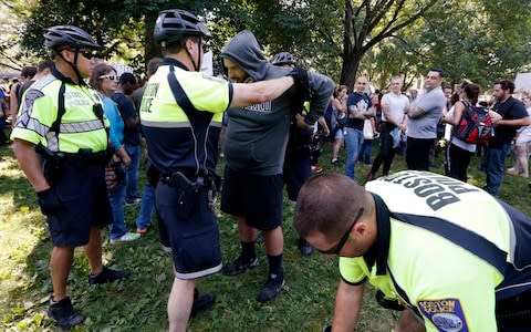 State and city police inspect people arriving for a "Free Speech" rally on Boston Common - Credit: Michael Dwyer/AP 